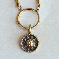 Hammered Sun Coin Charm